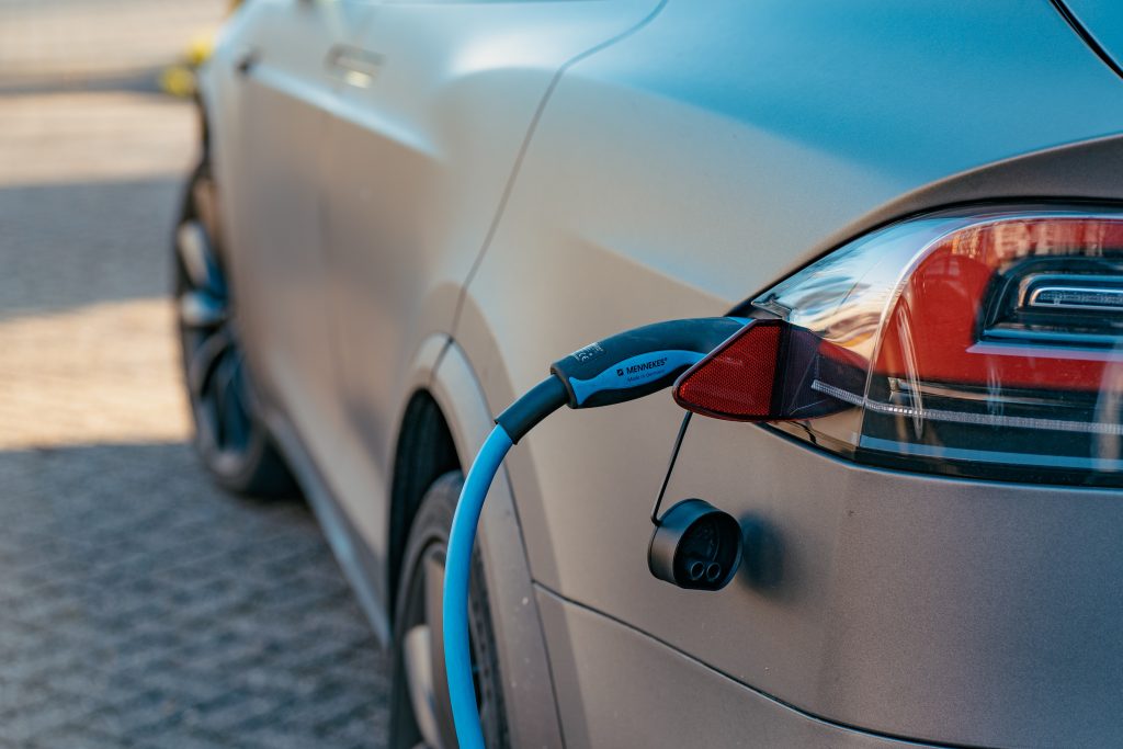 Gray Electric vehicle being charged