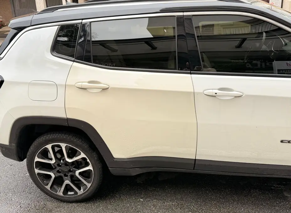 A White Jeep Compass with Mismatched Paint, an example of repair related diminished value