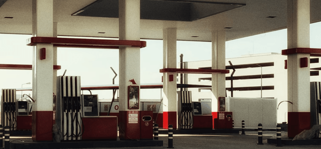 Fuel Station Pumps Illustrating How Gas Prices Affect Used Car Values – Diminished Value of Georgia, Car Appraisals for Insurance Claims Empty fuel station with rows of gas pumps, illustrating how sustained gas prices are reshaping used car values | Diminished Value of Georgia, Car Appraisals for Insurance Claims
