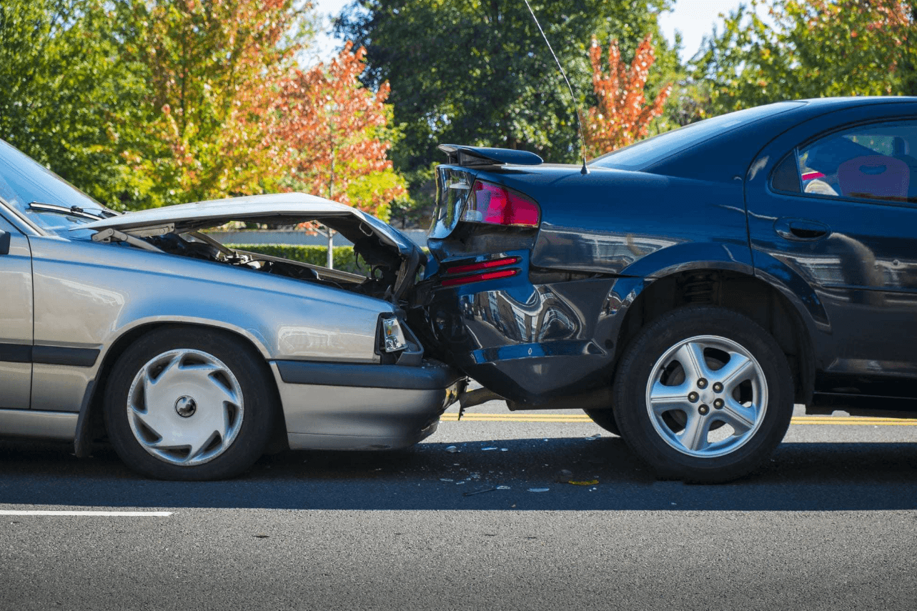 Two Cars with Collision Damage After Rear-End Accident – Diminished Value of Georgia, Car Appraisals for Insurance Claims Red and black cars with front and rear collision damage after an accident, illustrating diminished value loss on a financed car in Georgia | Diminished Value of Georgia, Car Appraisals for Insurance Claims