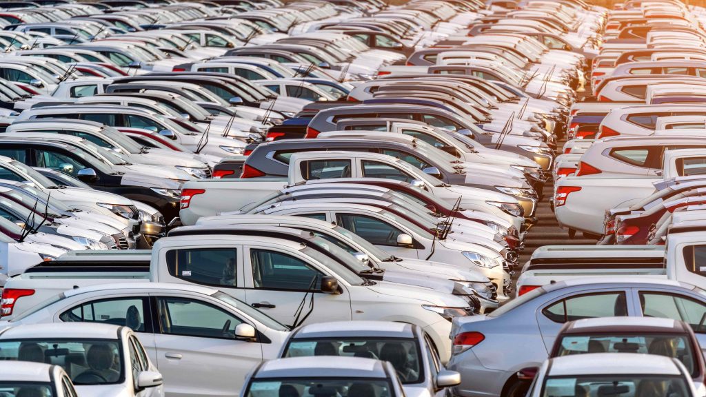 row of new cars in a port